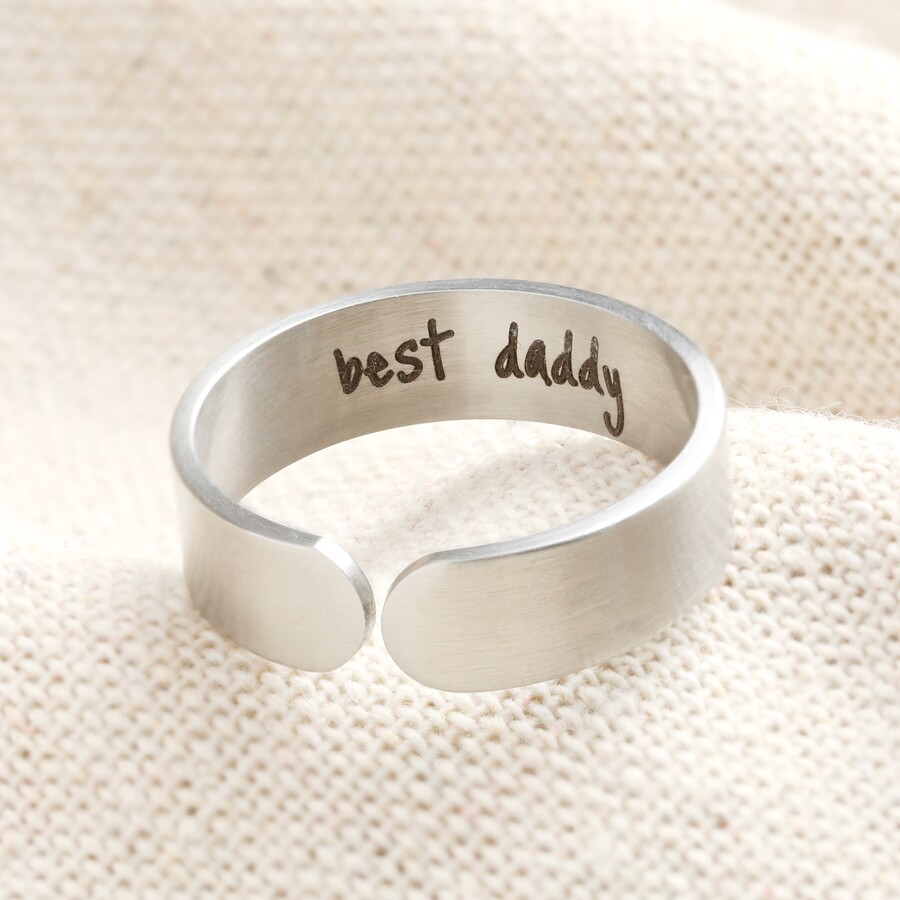 A Sleek Steel Ring with a Brushed Finish and Your Message Engraved in the Inside