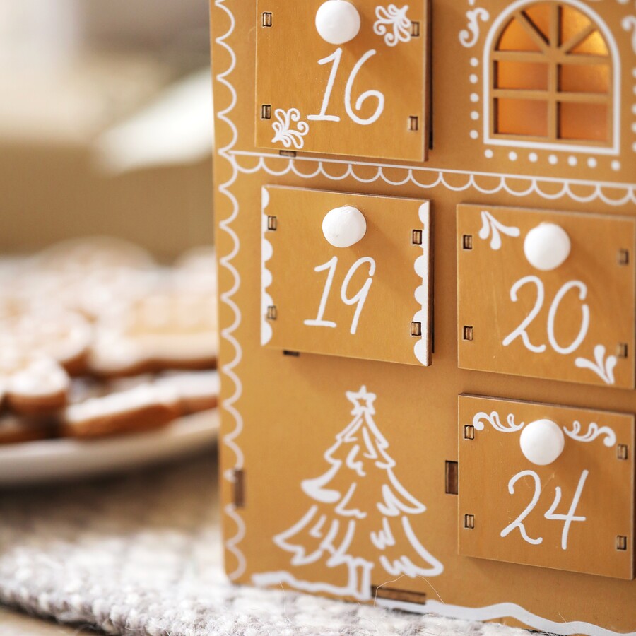 vintage book advent calendar with crystals and lit candle