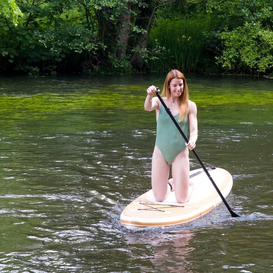 carly rowena paddle boarding on the river