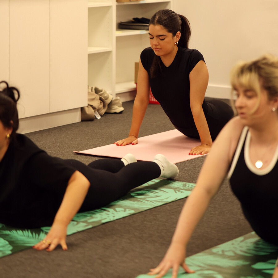 Women Doing Cobra Pose in Yoga 