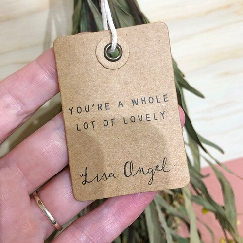 a kraft card tag that reads you're a whole lot of lovely