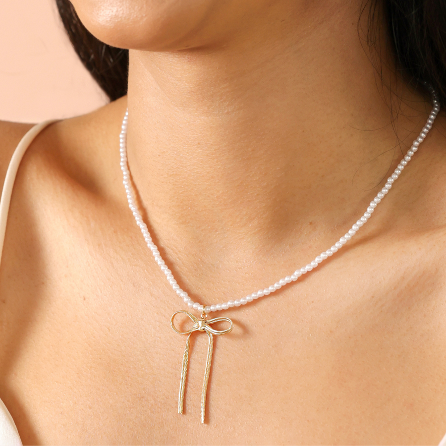 Pearl Necklace with Large Bow Pendant in Gold