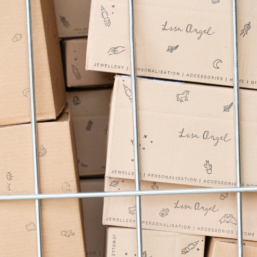 A close-up of Lisa Angel plastic-free cardboard packages