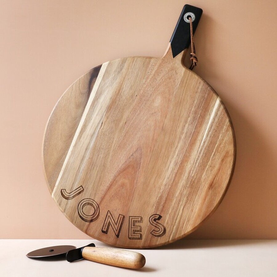 This Personalised Pizza Board Can Have your Married Name Engraved for a Special Wood-Themed Anniversary Gift He'll Never Forget