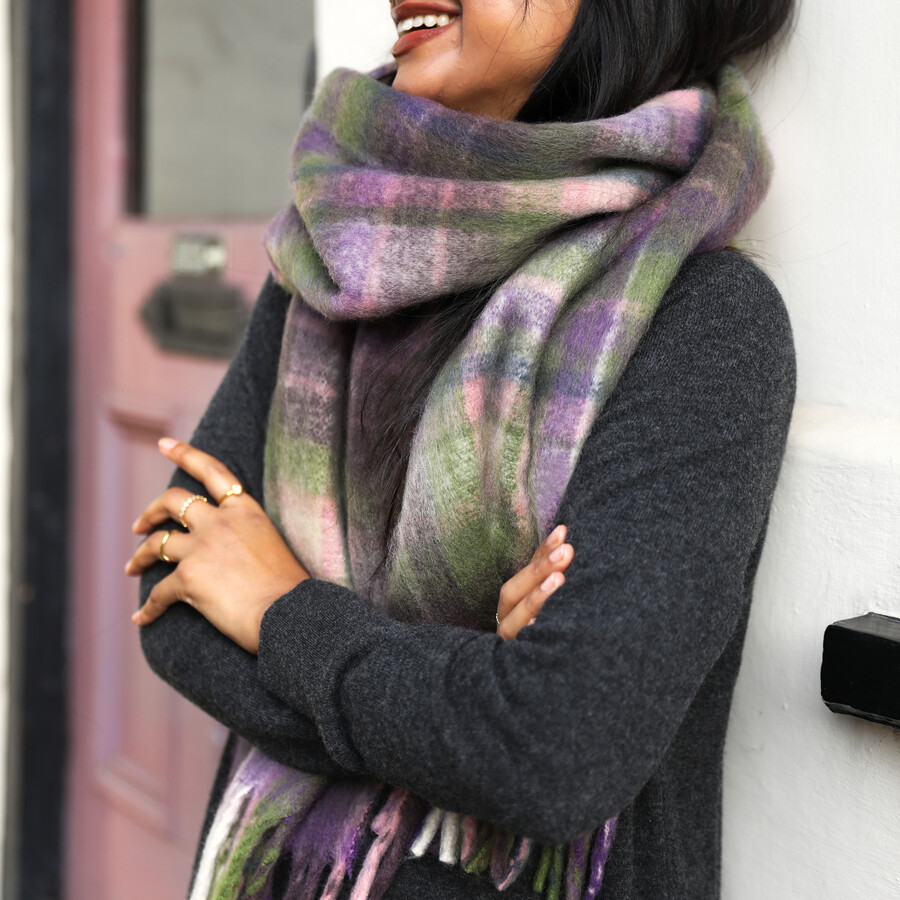 This sleek and stylish winter scarf features timeless dark shades mixed with lighter pastels ideal for those who like to embrace seasonal shades