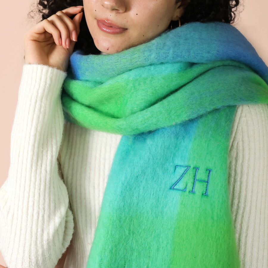 Model Wearing a Green and Blue Ombre Patterned Woolly Scarf Embroidered with Z and H Initials