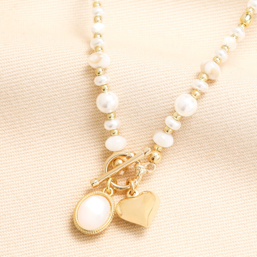 Add a Striking Touch to an All Gold Necklace Stack with This Stunning Pearl and Gold Pendant Necklace