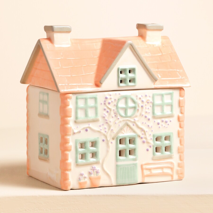 This sweet house wax melt burner is ideal for gifting to a mother-in-law who adores cosy home decor