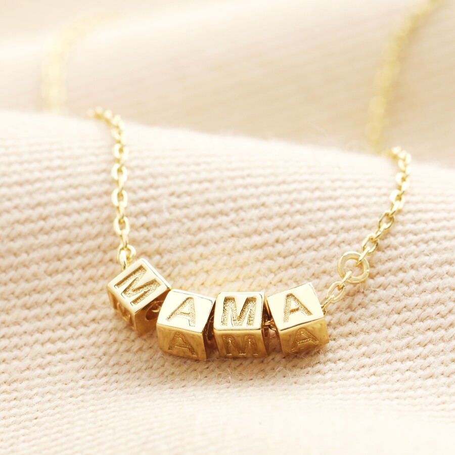 A Stunning Gold Plated Chain Necklace with Four Block-Shaped Charms With Letters That Spell Out Mama