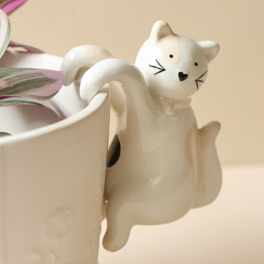 A White Ceramic Cat Shaped Plant Pot Hanger