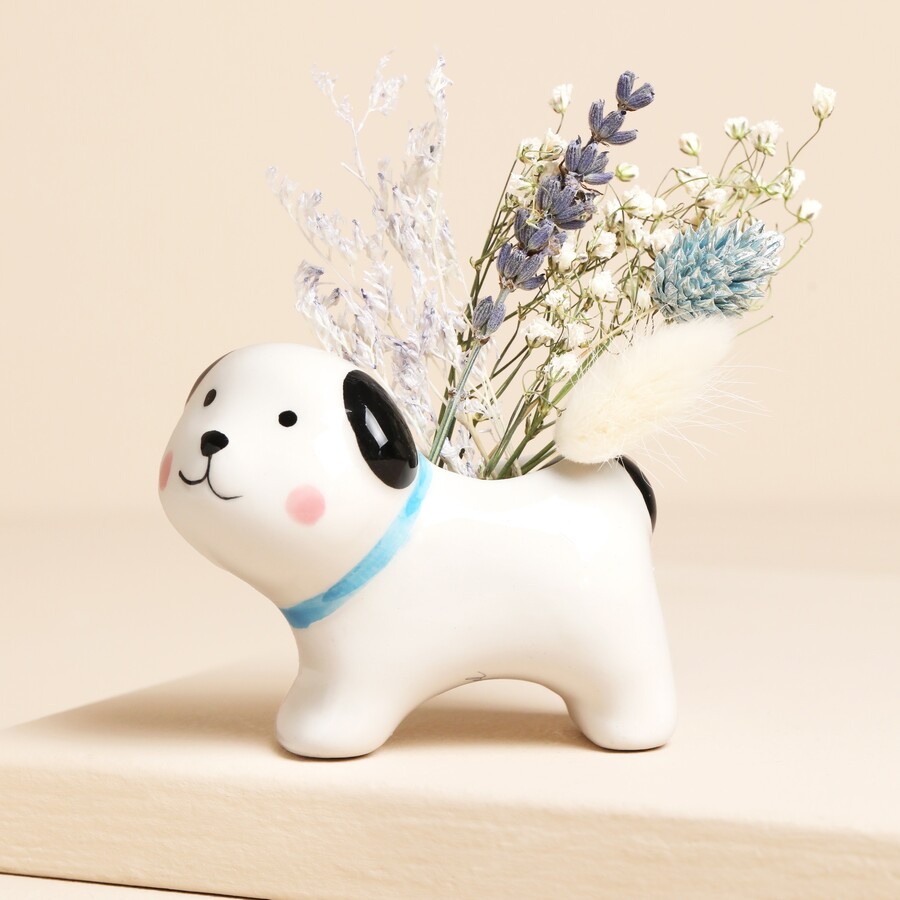 A Cute Ceramic Dog-Shaped Vase in White Filled with Dried Flowers