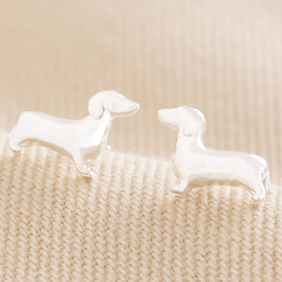 A Small Silver Pair of Dacschund-Shaped Stud Earrings