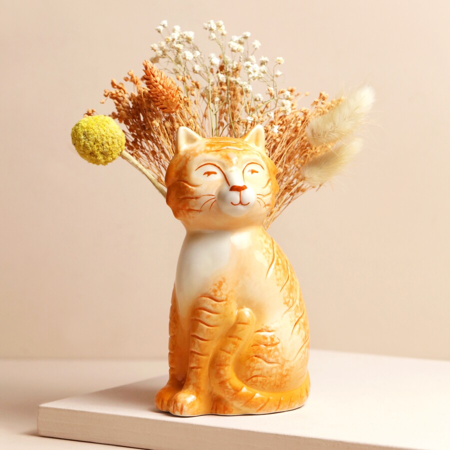 An Orange Cat-Shaped Vase Filled with Dried Flowers