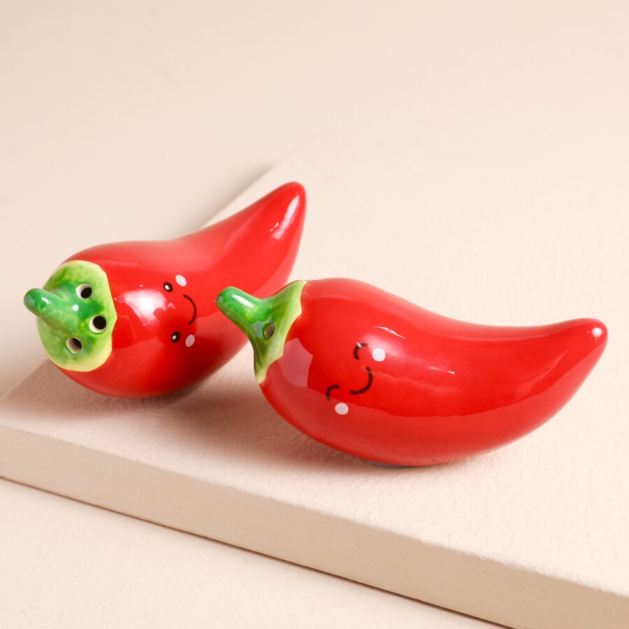 This Duo of Seasoning Shakers in the Shape of Two Chillies is Perfect for Adding a Pop of Colour and Fun to your Tablescape