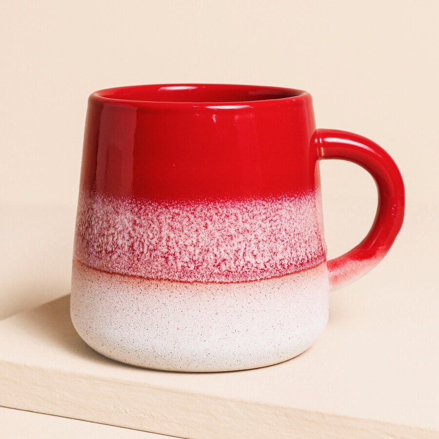 A Red and White Ombre Mug With a Half Glaze Effect