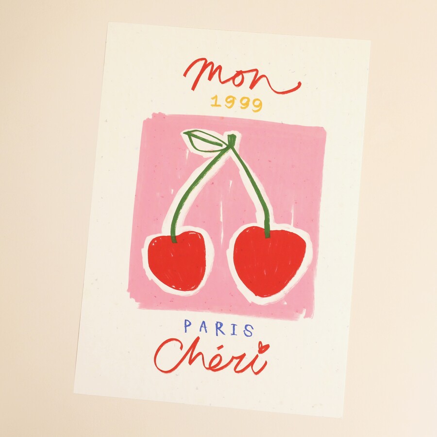 A White and Pink Print with Two Cherries in the Centre and Mon Cheri Wording