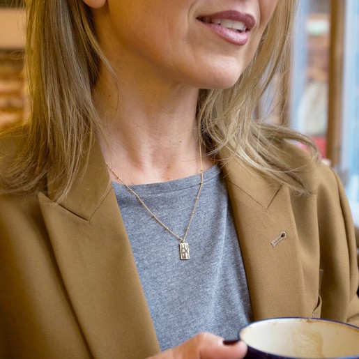 Tiny Hammered Tag Pendant Necklace in Gold on Model