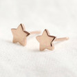 Lisa Angel Rose Gold Sterling Silver Star Stud Earrings on Wooden Bauble