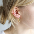 Model Wearing Lisa Angel Ladies' Curved Rectangle Hoop Earrings in Gold