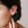 Ladies' Crystal Moon and Star Charm Ear Cuff in Rose Gold on Model