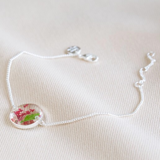 Bracelet on Neutral Fabric Pressed Birth Flower Charm Bracelet in Silver on Neutral Fabric