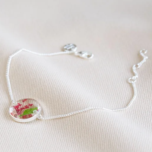 Pressed Birth Flower Charm Bracelet in Silver on Neutral Fabric