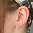 Chain Huggie Hoop Earrings in Silver on Model