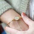 Personalised Real Pressed Baby's Breath Flower Bangle in Gold on Model