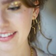Large Organic Finish Star Earrings in Gold on Model