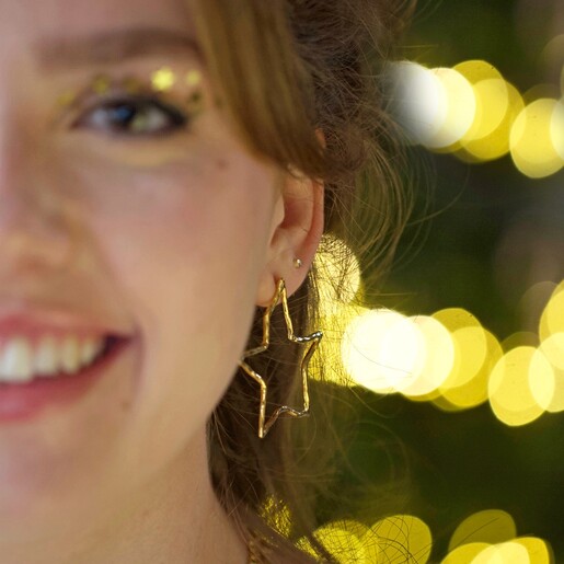 Large Organic Finish Star Earrings in Gold on Model