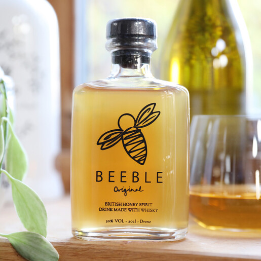 Lisa Angel with 20cl Bottle of Beeble Honey Whisky