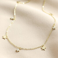 Tiny Crystal Star Charm Necklace in Gold