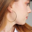 Women's Large Thin Hoop Earrings in Gold Sterling Silver on Model