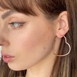 Ladies' Large Heart Hoop Earrings in Rose Gold on Model