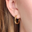 Small Hammered Gold Hoop Earrings on Model