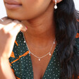 Tiny Crystal Star Charm Necklace on Model