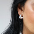 Wide Irregular Shape Hoop Earrings in Silver on Model