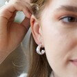 Wide Irregular Shape Hoop Earrings in Silver on Model