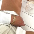 Model Wearing Flat Figaro Chain Bracelet in Gold