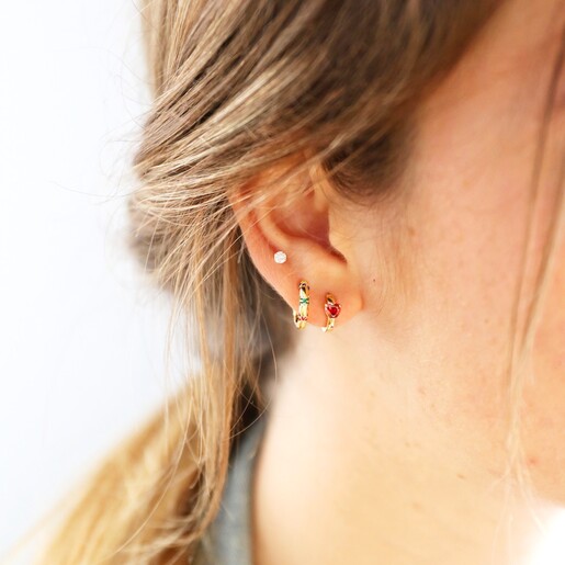 Model Wearing Crystal Red Heart Huggie Hoops in Gold