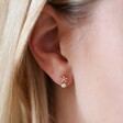 Model Wearing Crystal Snowflake Earrings with Opal in Gold 