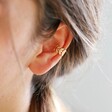 Female Model Wearing Delicate Fern Ear Cuff in Gold