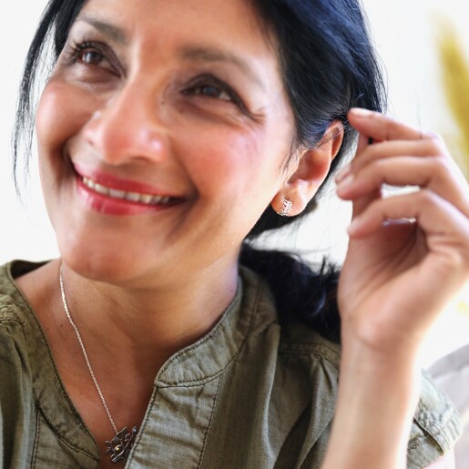 Model Wearing Delicate  Fern Leaf Huggie Hoop Earrings in Silver