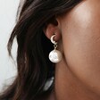 Model Wearing Ladies' Large Mismatched Crystal Star and Moon Pearl Drop Earrings