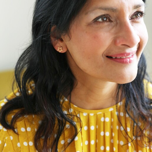 Mismatched Star Stud Earrings in Gold on Model