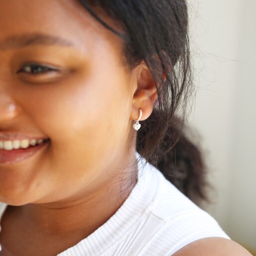 Polished Heart Huggie Hoop Earrings on Model