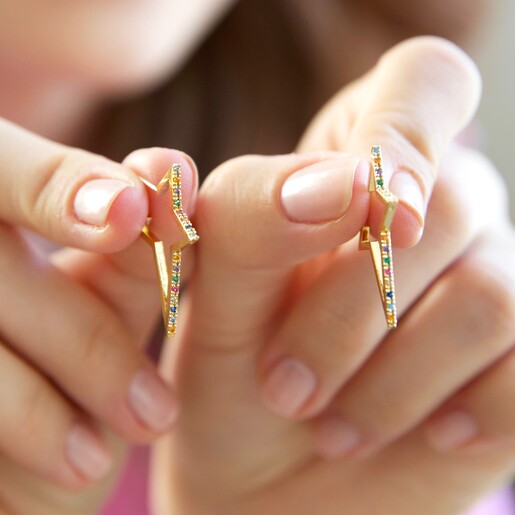 Hands Holding Slim Rainbow Crystal Star Outline Hoop Earrings