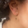 Thread Through Mismatched Heart Earrings on Model