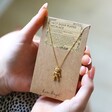 Ladies' Gold Dancing Teddy Bear Pendant Necklace on Recycled Card