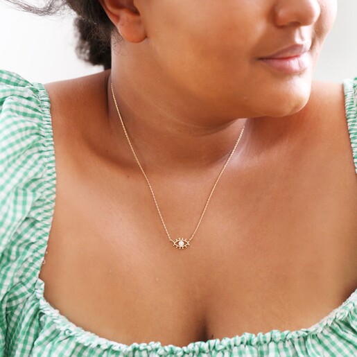 Female Model Wearing Lisa Angel Clear Crystal Eye Charm Necklace in Gold
